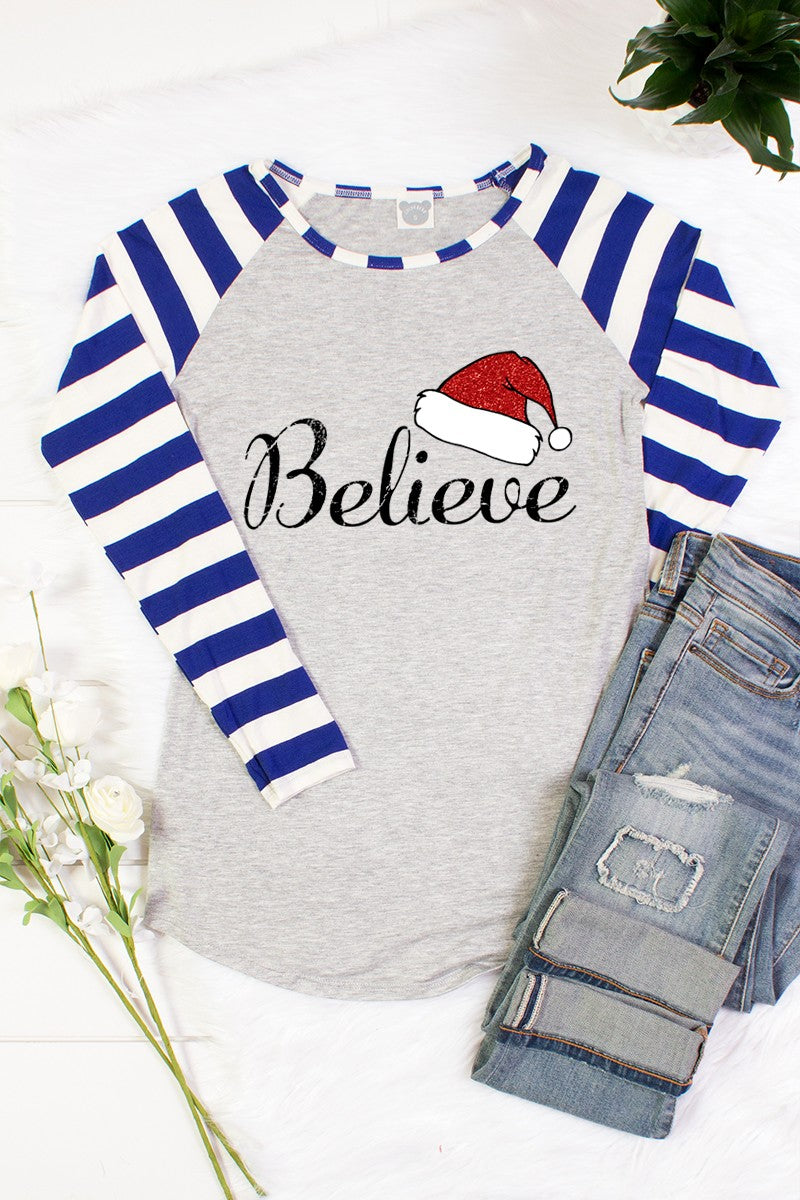 SALE Merry Christmas Believe Santa Hat Striped Sleeve Raglan Long Sleeve T-Shirt - SimplyCuteTees